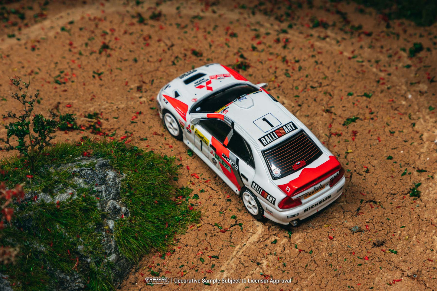 (Preorder) Tarmac Works 1:64 Mitsubishi Lancer Evolution IV Rallye Monte-Carlo 1997 Tommi Mäkinen / Seppo Harjanne T64G-076-97MCR01