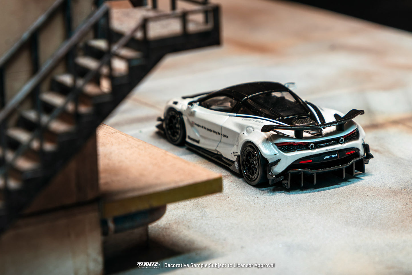Model car on a display stand with a blurred background