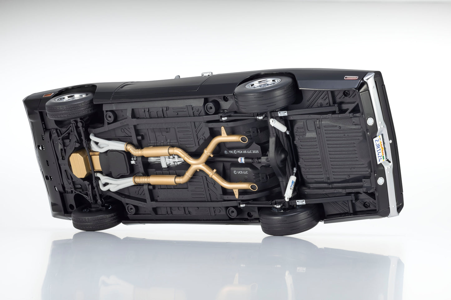 Undercarriage of a vehicle showing mechanical components on a white background