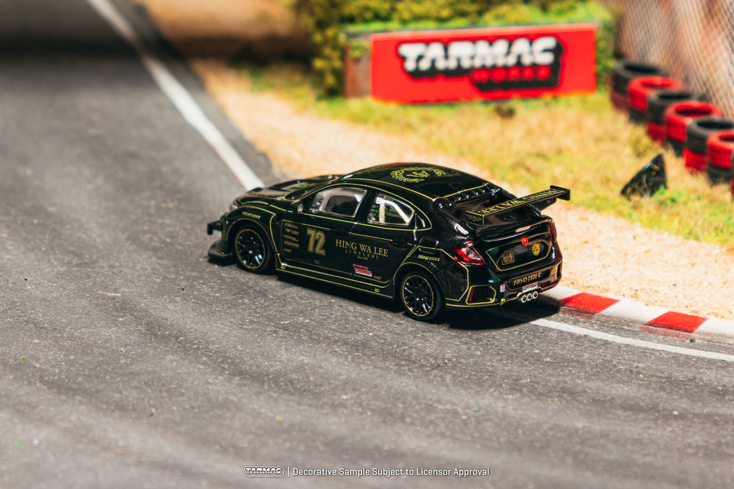 Model car on a track with Tarmac Toys branding in the background