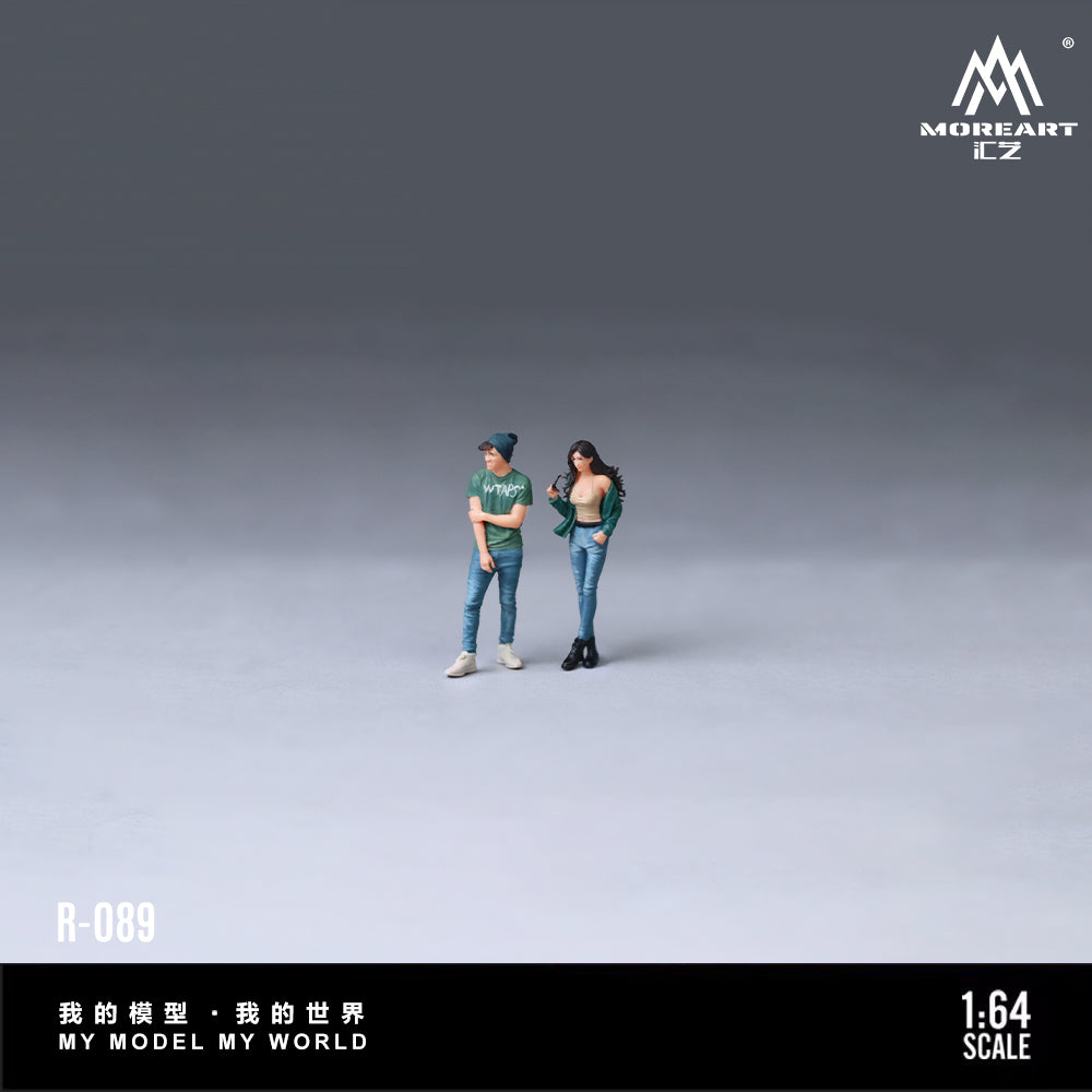 Two action figures of a couple standing with 'MoreArt' branding.