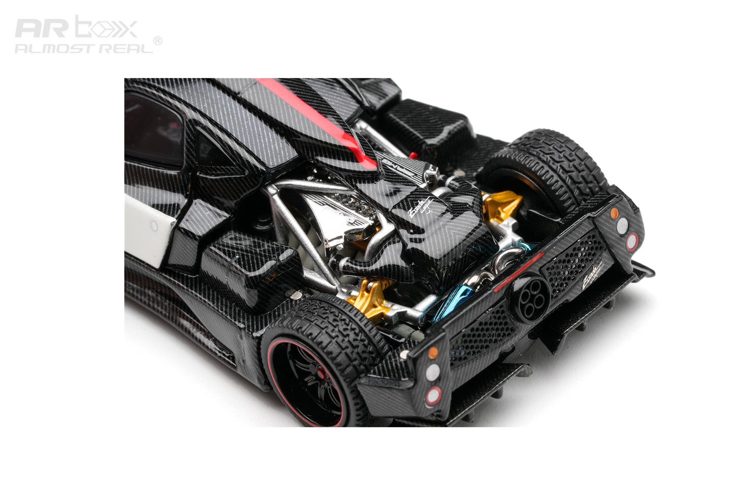 A close-up studio shot of a black carbon-fiber RC car model, showing the rear and side details, including exposed silver and gold mechanical elements, on a white background with an ARbox logo in the top-left corner.