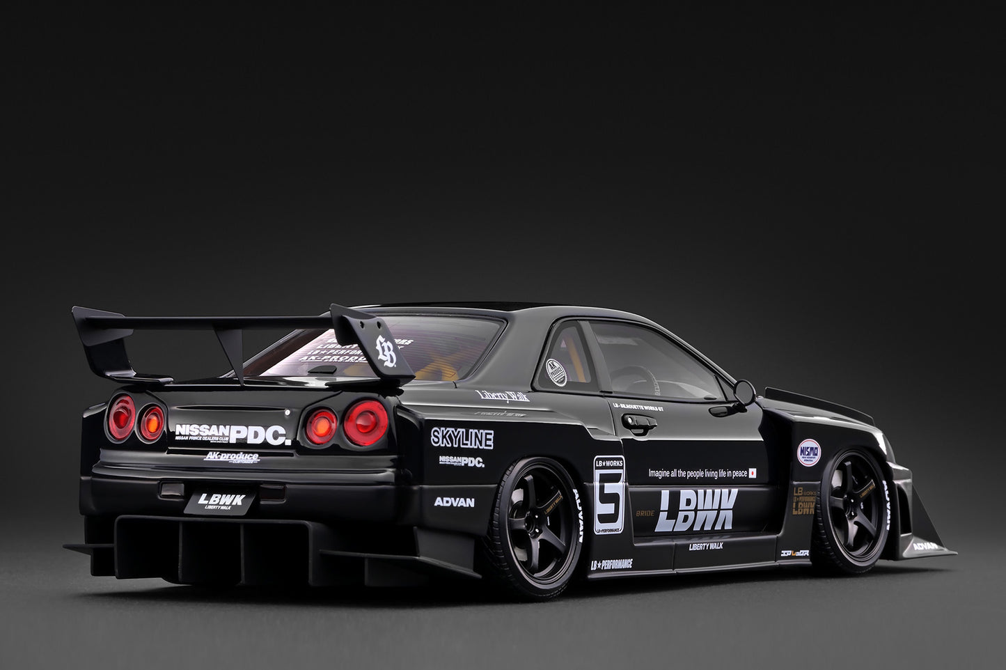 A black widebody sports car model with racing decals, including 'LBK', 'SKYLINE', and 'HESWAPDC', shown from a rear three-quarter angle against a dark studio background.