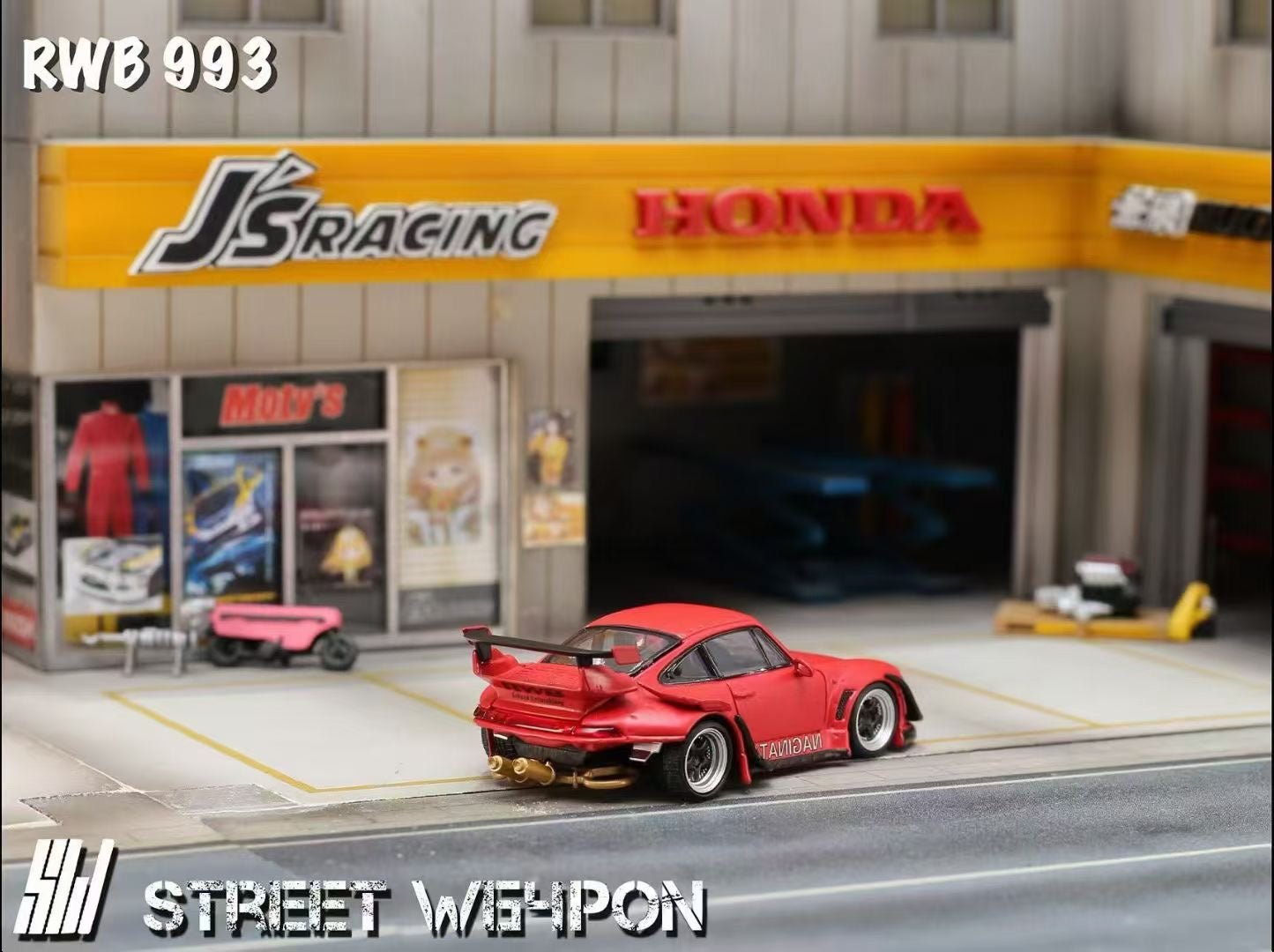 Red car in front of a Honda dealership with 'JS Racing' branding.