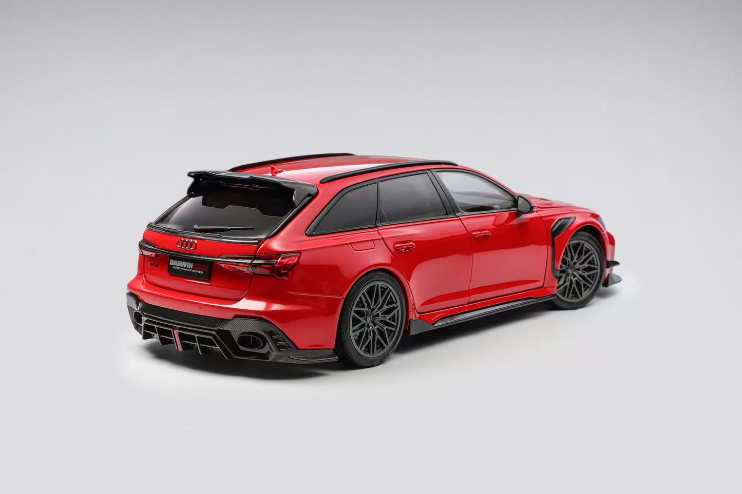 Red Audi RS6 Avant car on a gray background