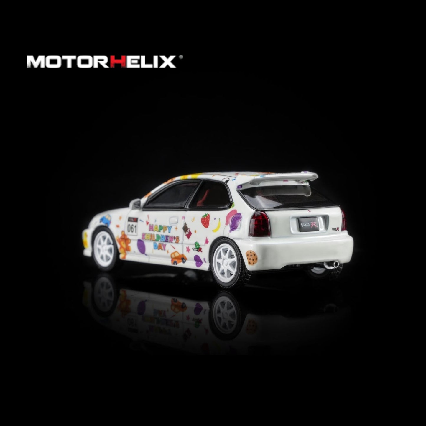 A white diecast model car with colorful retro graphics and text, shown from a three-quarter rear angle on a black reflective background with the MOTOR HELIX logo in the top left.