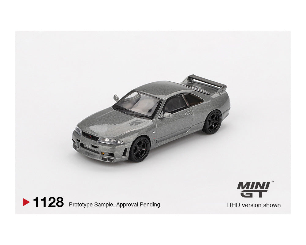 Model car of a Nissan Skyline GT-R on a white background with 'MINI GT' branding.