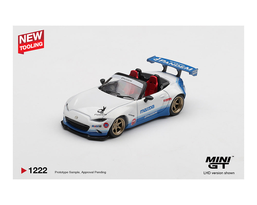 Model car of a Mazda MX-5 Miata in white with blue accents and racing decals, featuring red seats and a large rear spoiler. Branding says "Pandem."