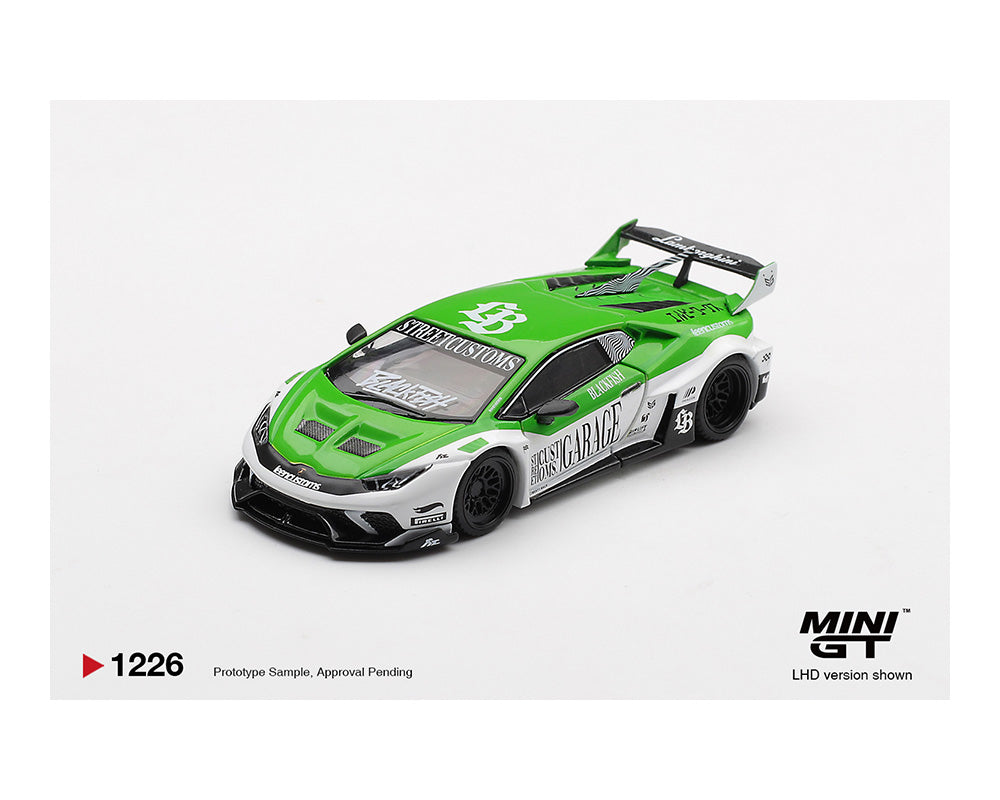 Green and white model car with 'MINI GT' branding on a white background