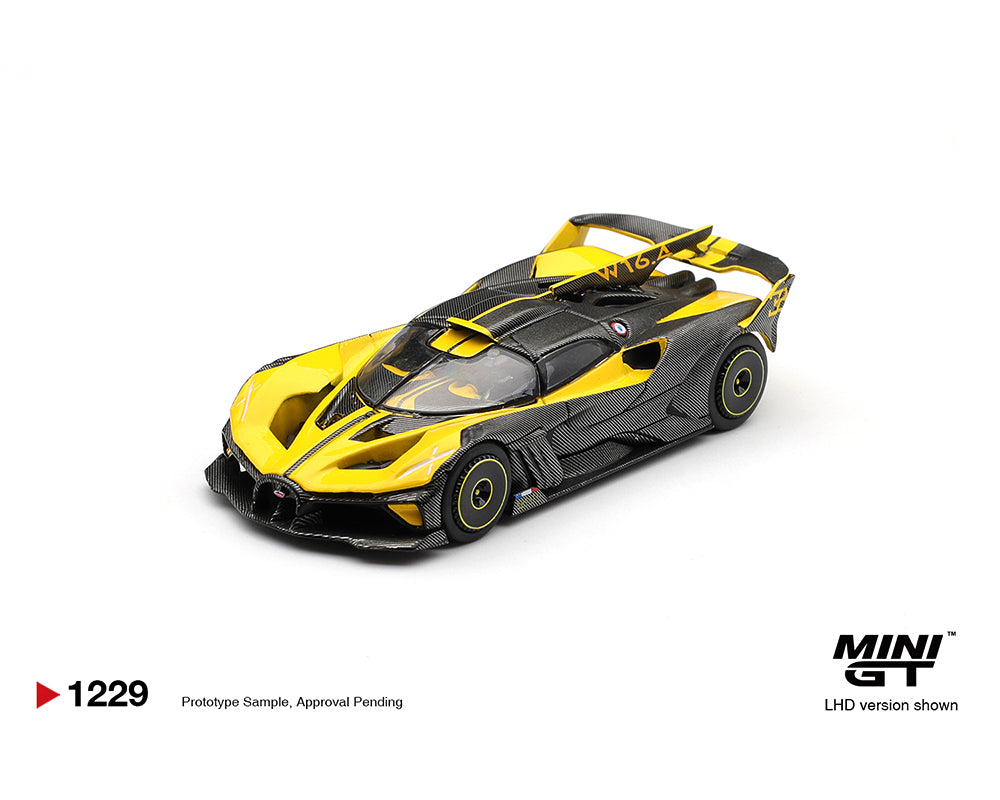 Yellow and black model car on a white background with MINI GT branding.