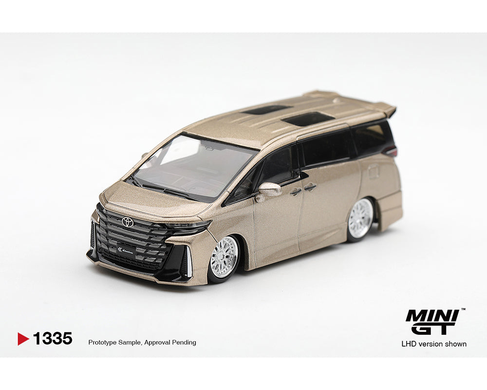 MINI GT MGT01335-BL Toyota Vellfire Z Premier Modellista 1:64 diecast model in Precious Metal, shown from a front left three-quarter view with the Modellista body kit, lowered stance, multi-spoke wheels, panoramic sunroof and authentic Toyota detailing.