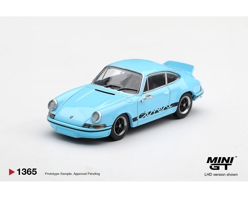 A light blue diecast model car of a Porsche 911 with black 'Carrera' side decals, shown on a white background with 'MINI GT' branding and product info text.