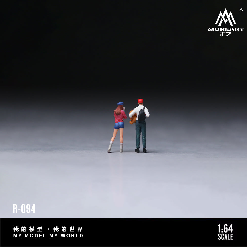 Two miniature figures standing on a gray surface with a dark background, featuring the brand 'MOREART'.