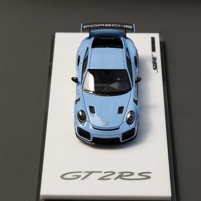Blue Porsche GT2 RS model car on a white display stand with 'SUNNY' branding.
