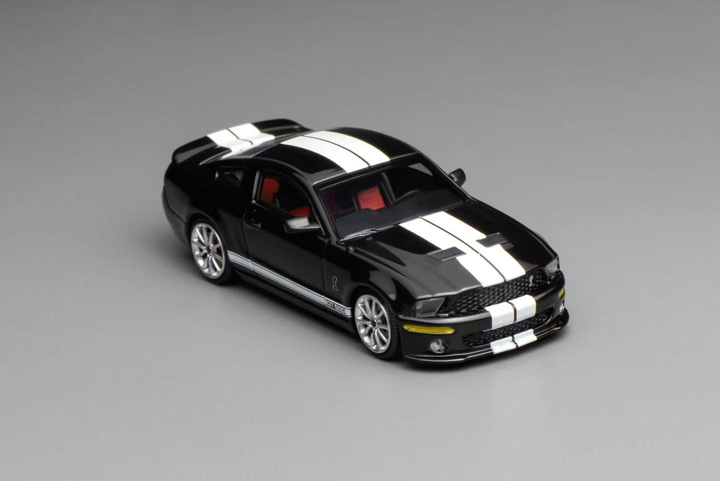 Black and white sports car model on a gray background