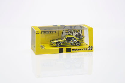 A yellow and black die-cast model car in its original packaging, featuring the Mooneyes brand and Moon logo on a clean white background.