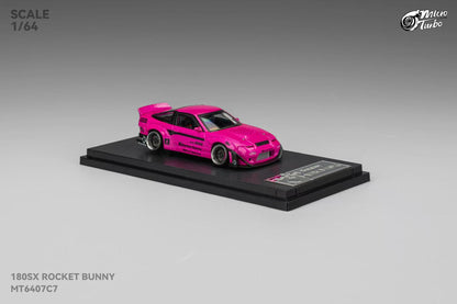 Model car of a pink 180SX Rocket Bunny on a gray background