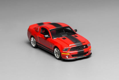 Red and black model car on a gray background