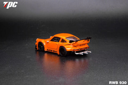 Orange model car with 'RWB' branding on a dark reflective surface