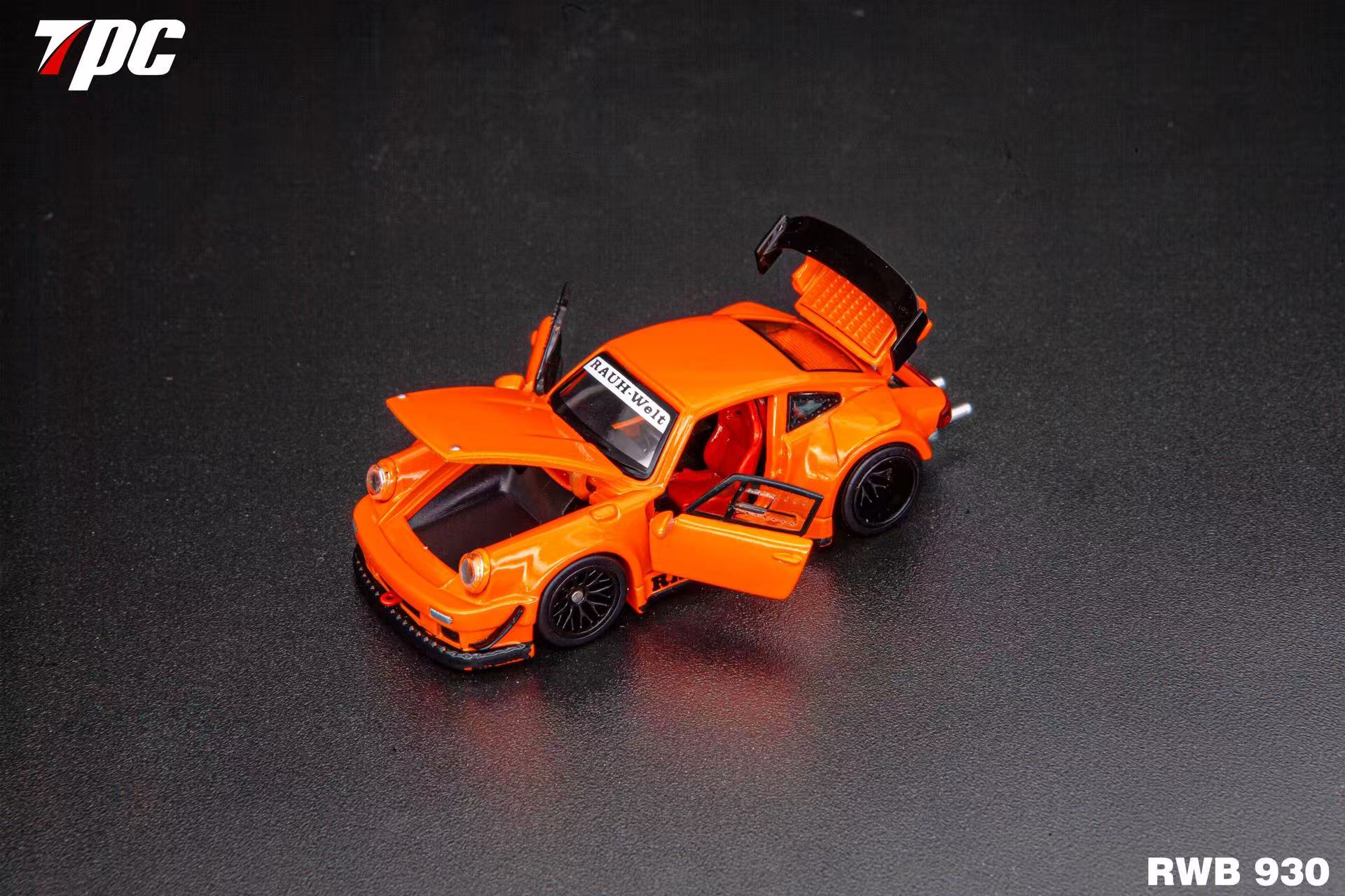 Orange model car with open doors on a dark background