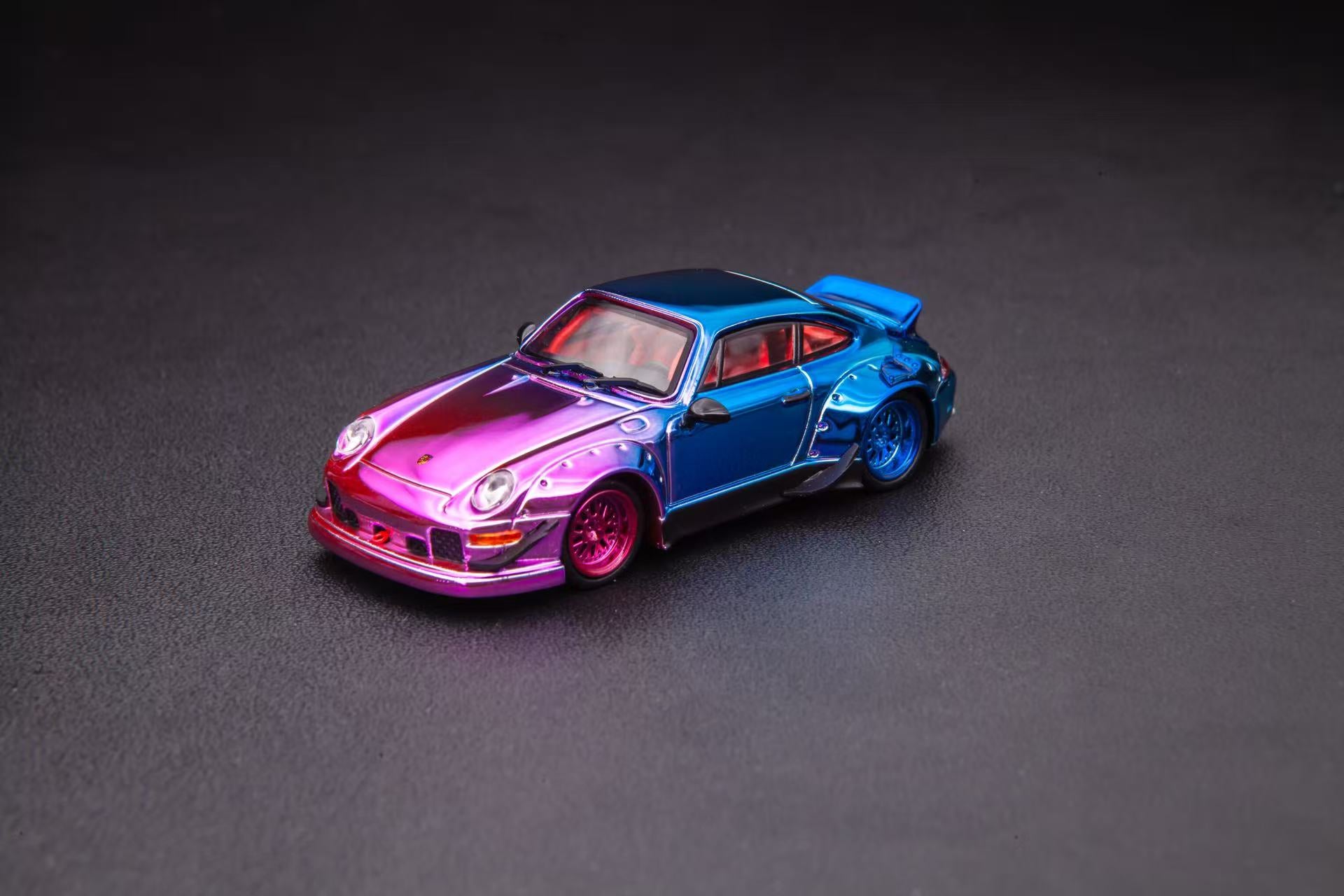 Colorful model car on a dark gray background