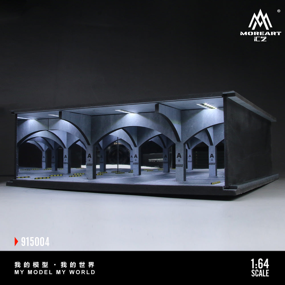 Model of a train station with arches and lights, displayed on a dark background.