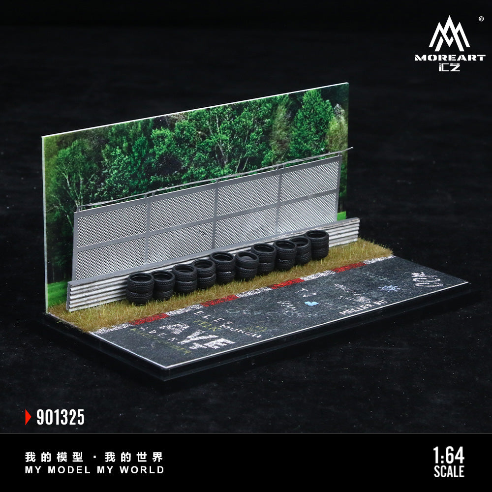Model racing track with tires and greenery, featuring MOREART branding.