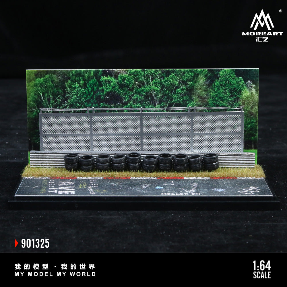 Model racing track with tires and fence, featuring MoreArt branding.