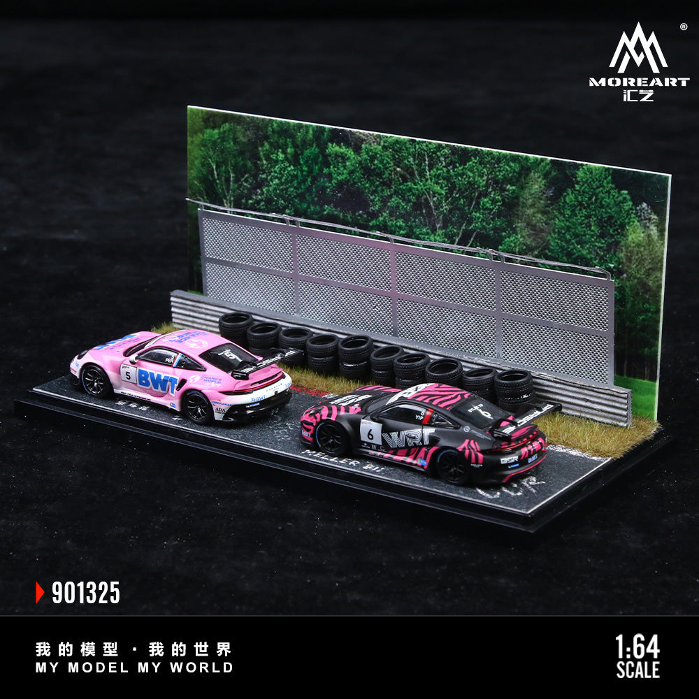 Model cars on a display stand with tires and a track background, featuring the brand 'MoreArt'.