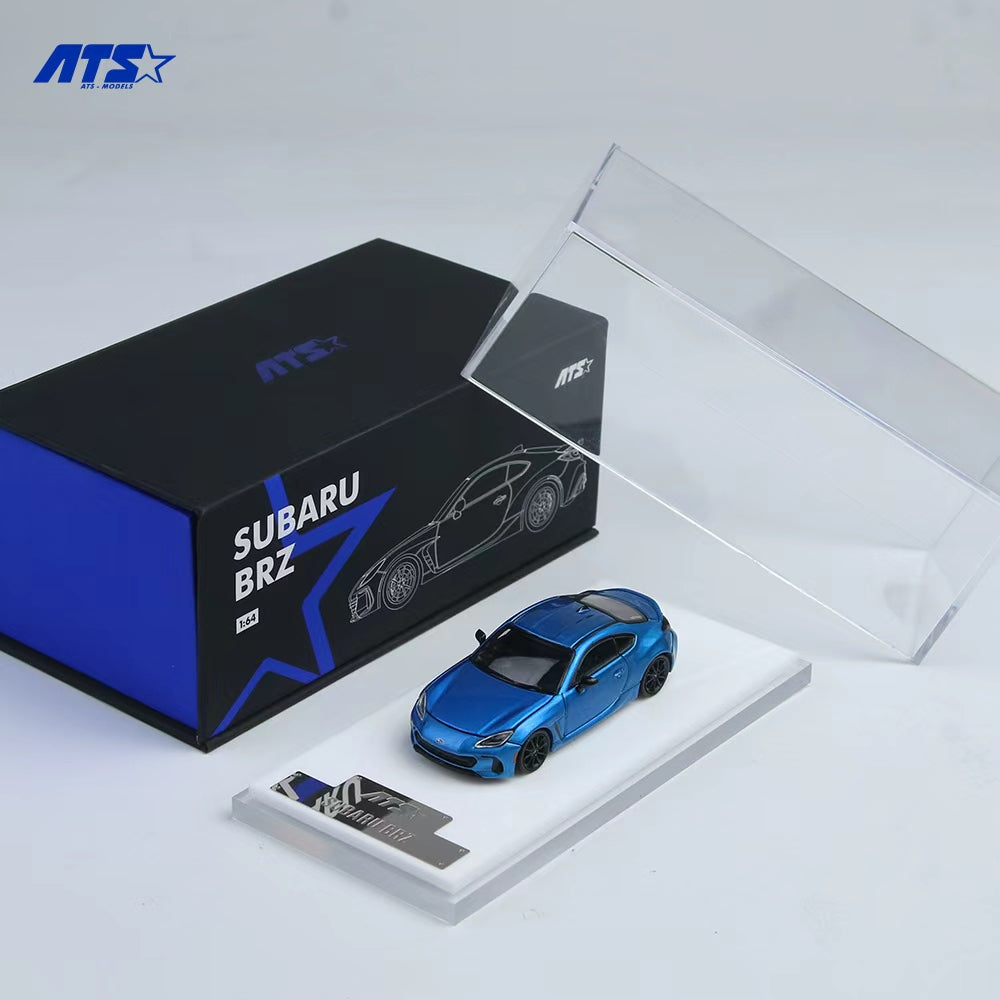 Blue model car of Subaru BRZ with packaging on a white background