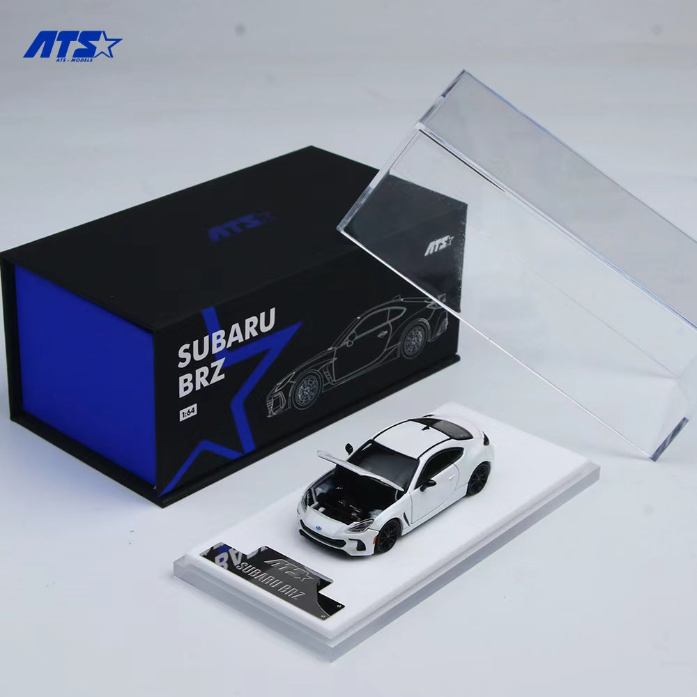 Model car of Subaru BRZ on a display stand with branded box in the background