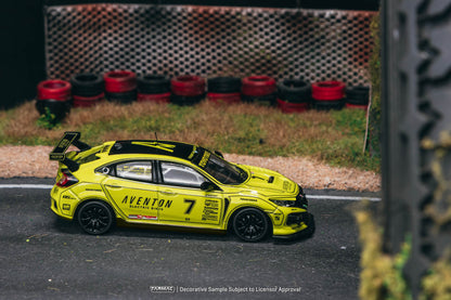 Yellow model car with 'Aventon' branding on a track with tires in the background
