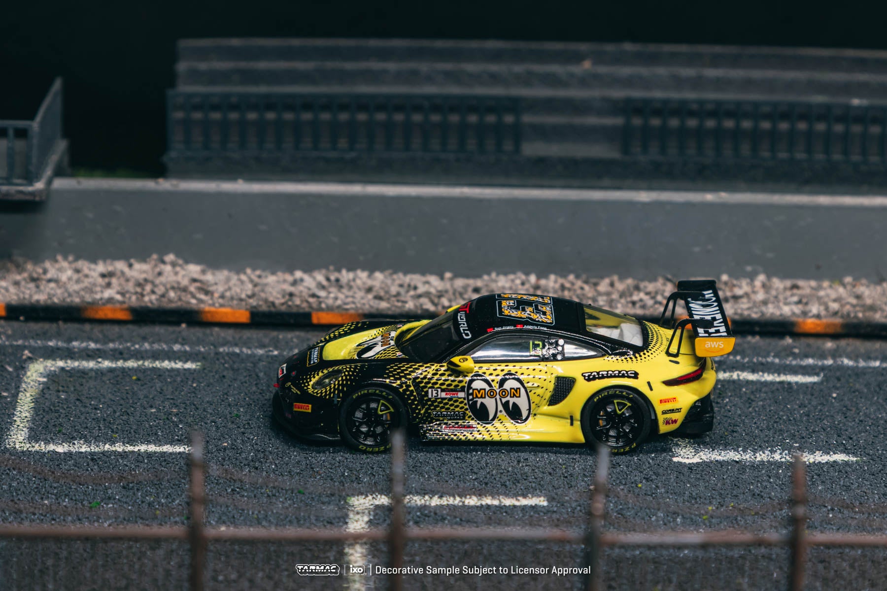 Yellow and black race car on a miniature track