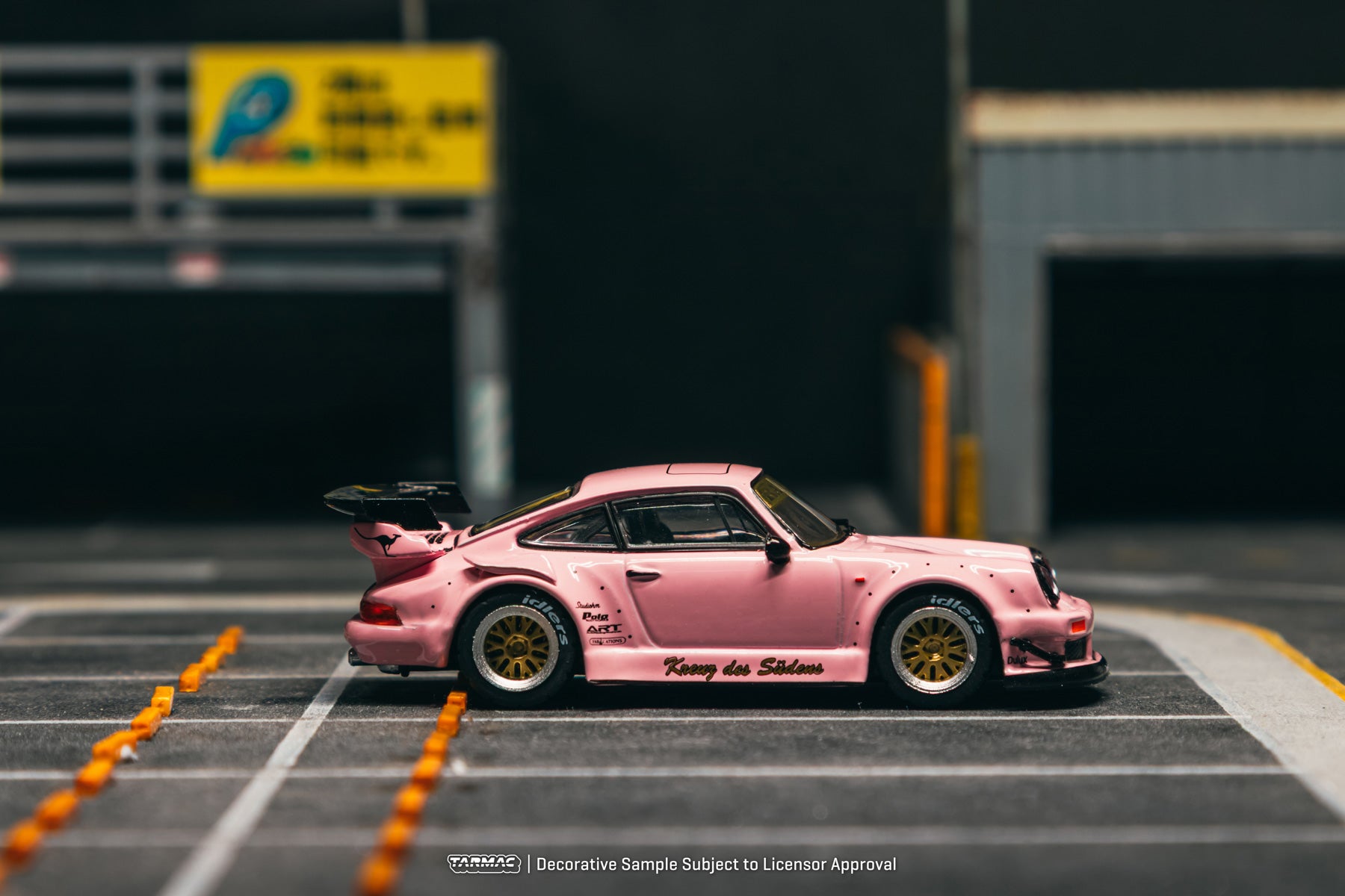 Pink model car on a track with blurred background