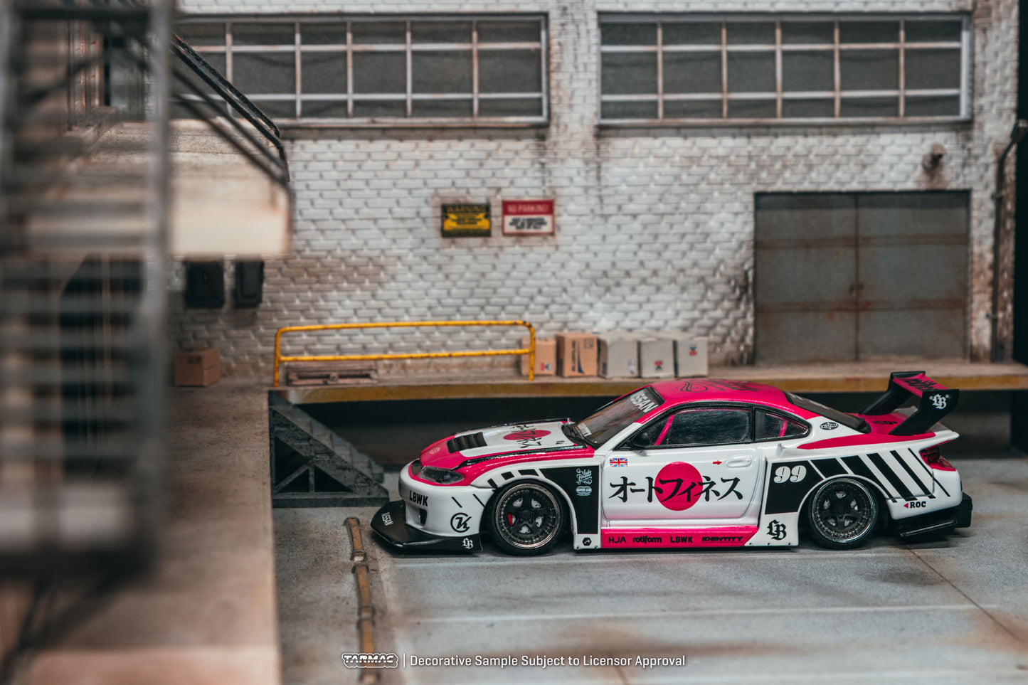 Model car with racing livery in an industrial setting