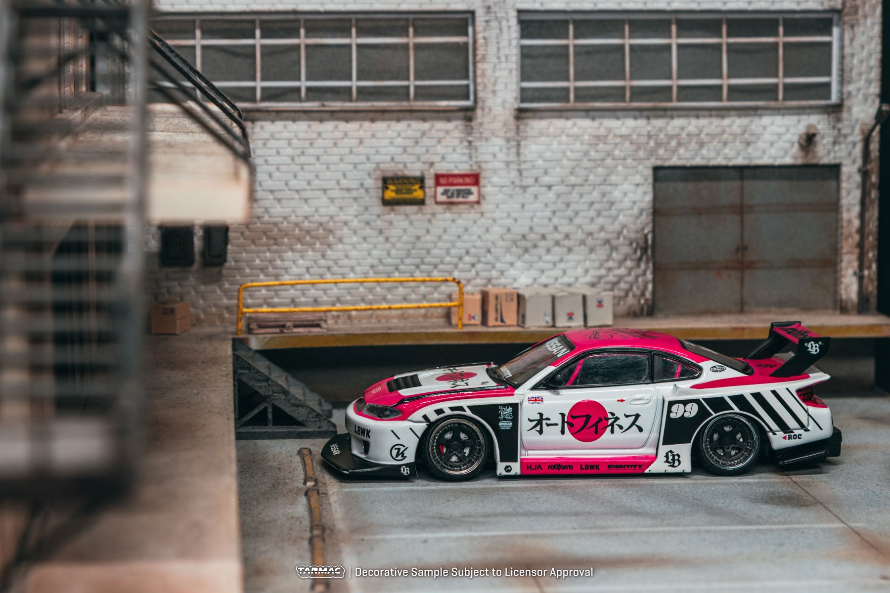 Model car with racing livery in an industrial setting