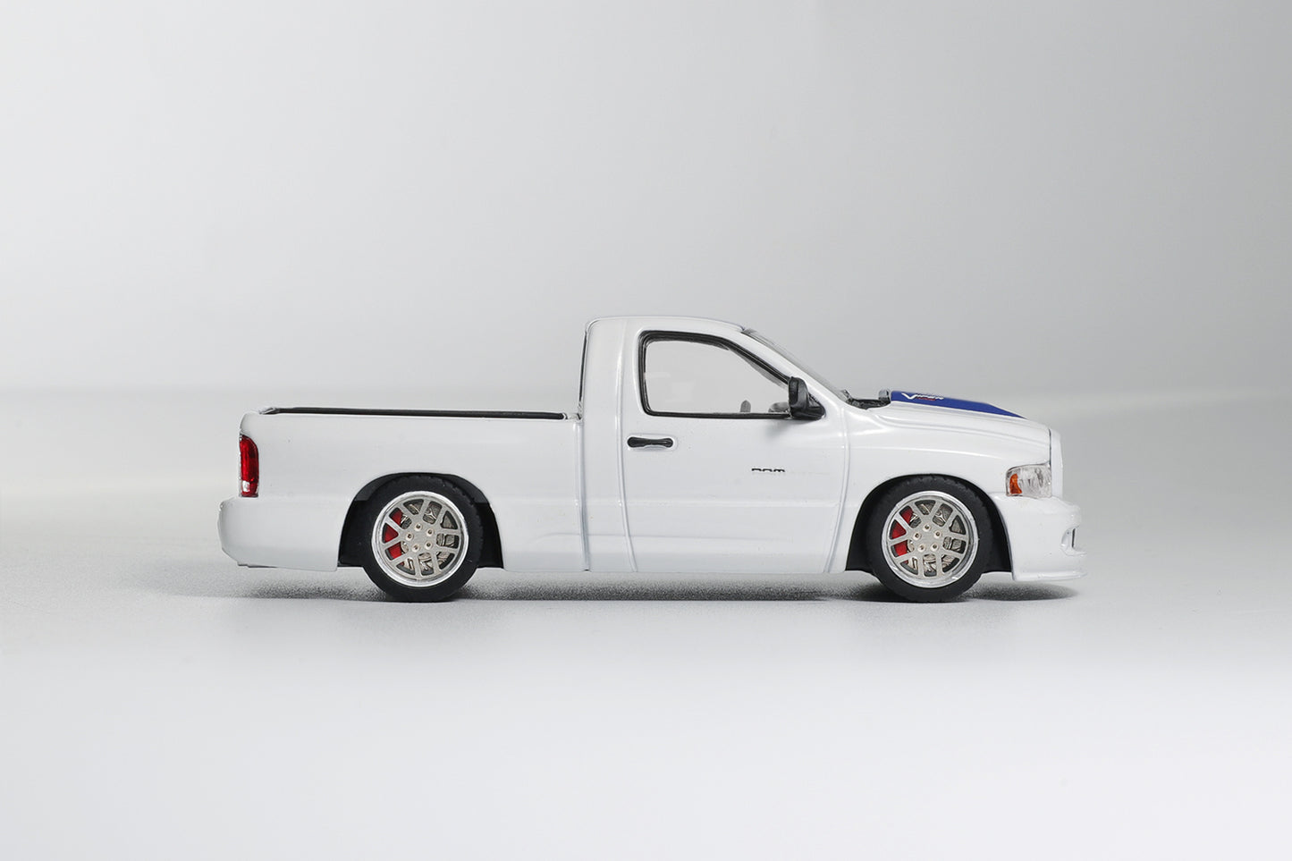 White pickup truck with black accents on a white background