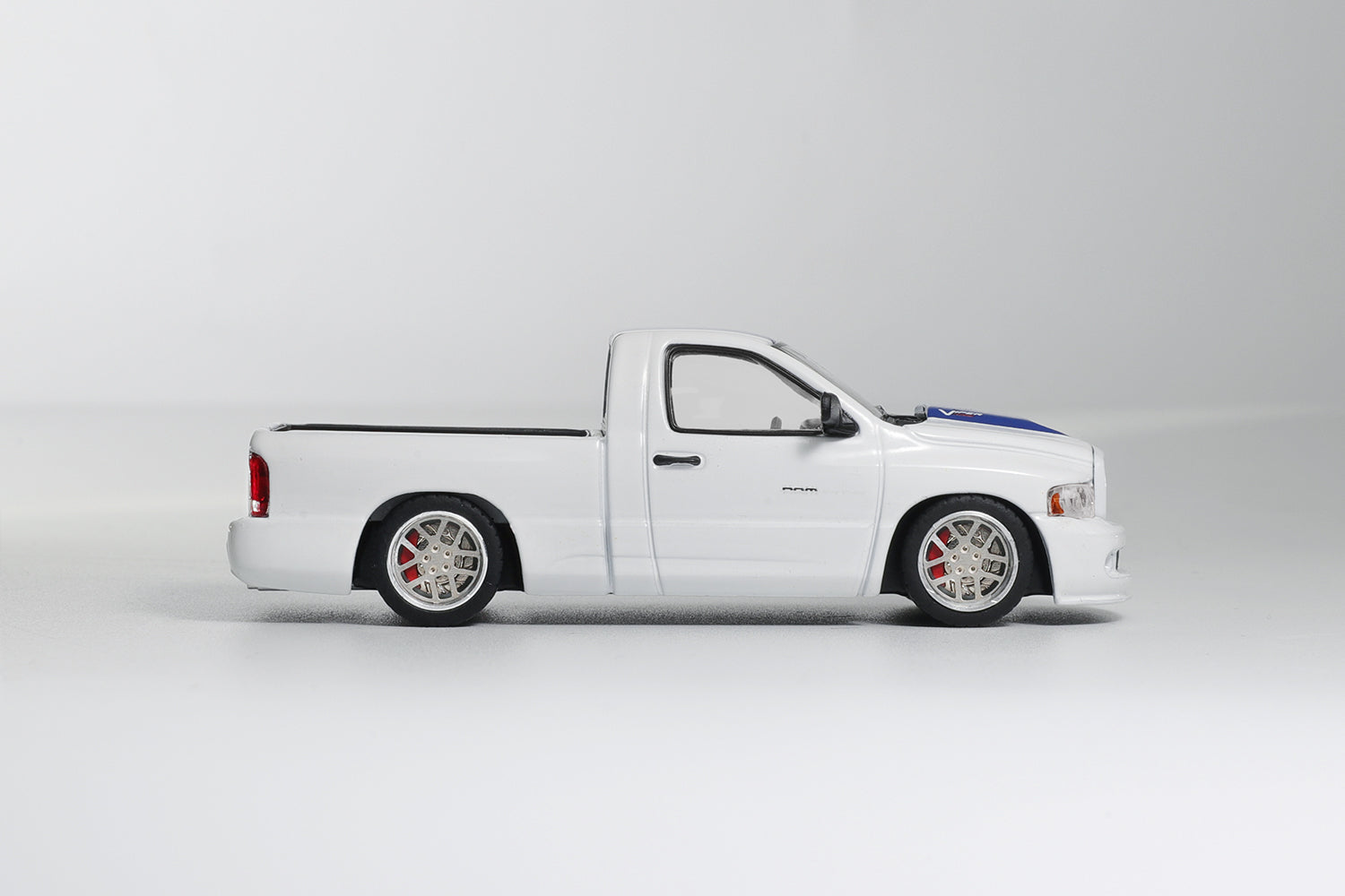 White pickup truck with black accents on a white background