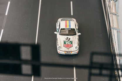 Model car on a track with visible branding