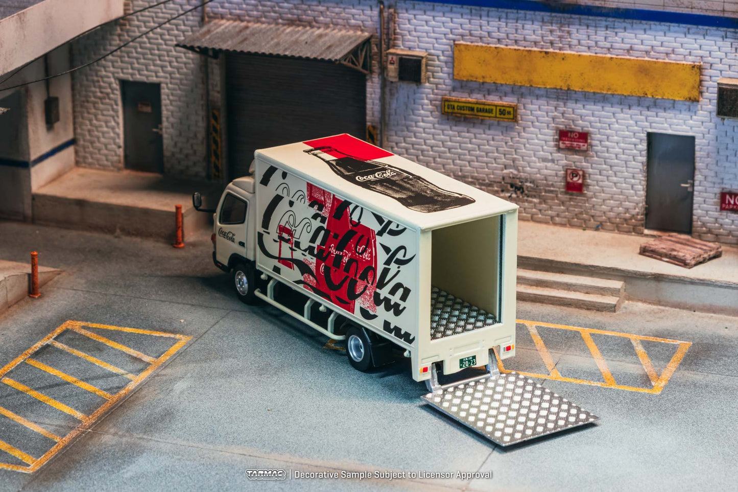 Model truck with graffiti design on a small scale model street scene