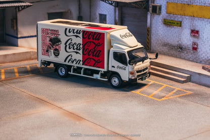 Model of a Coca-Cola delivery truck in an urban setting