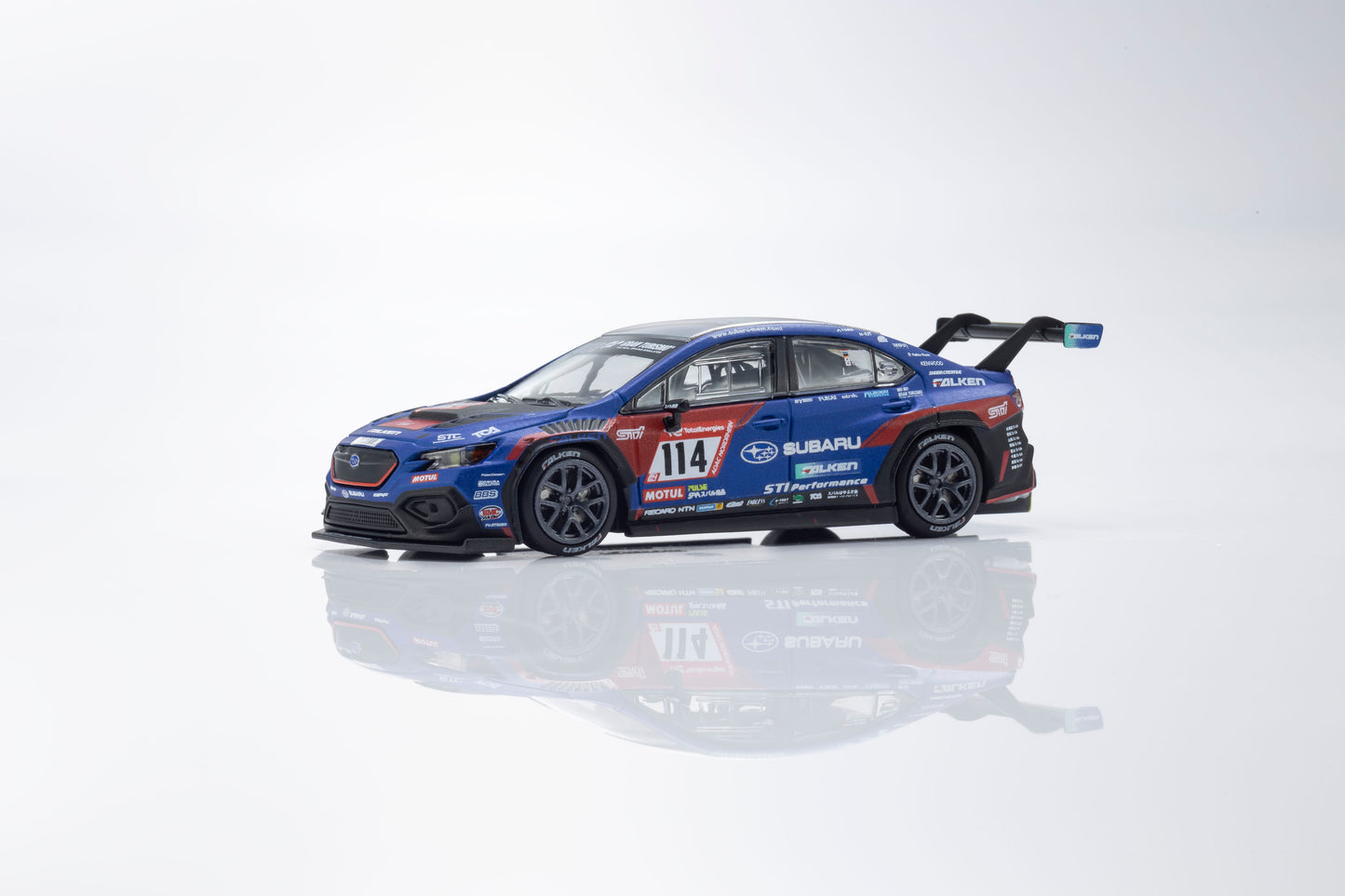 Model car with racing livery on a reflective surface