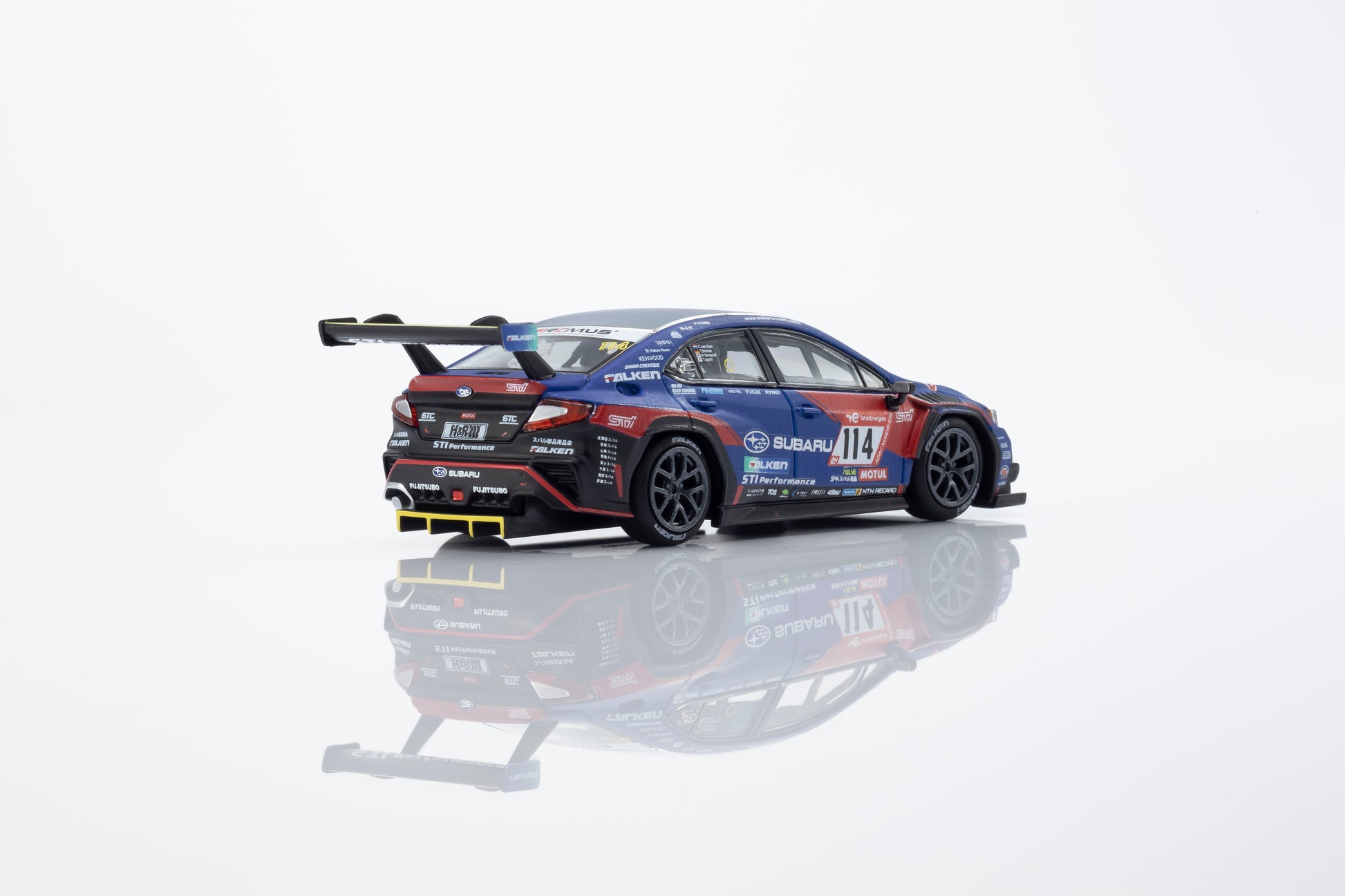 Model car with racing livery on a reflective surface