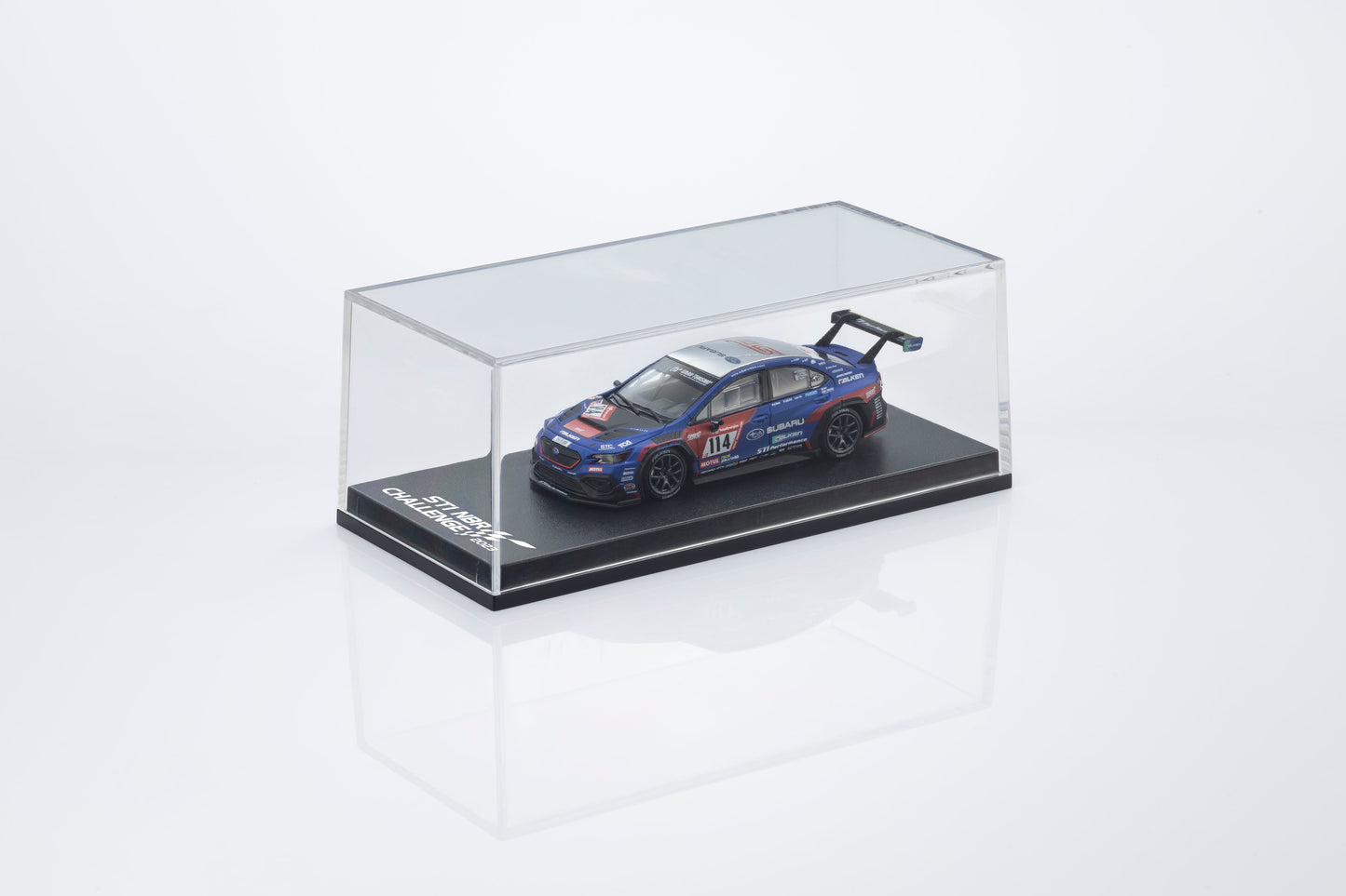 Model car in a clear display case on a white background
