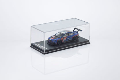 Model car in a clear display case on a white background