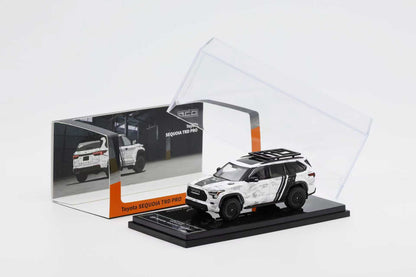 Model car of a SUV in a transparent display case on a white background