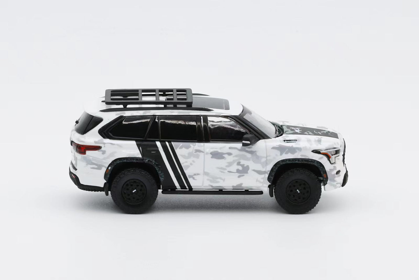 Model of a white SUV with black accents on a light gray background