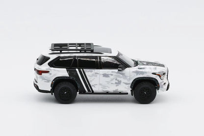 Model of a white SUV with black accents on a light gray background