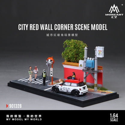 Model city scene with red wall, car, and people on a dark background