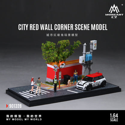 Model of a city street corner with a red wall, people, and a car on a dark background.